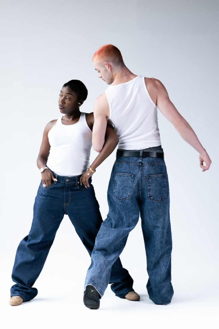 Two people wearing white tank tops and blue jeans on a white background